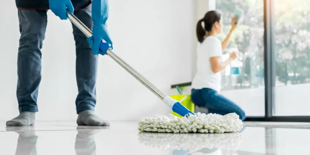 Floor cleaning service with mop and window cleaning in Washington DC. Professional home cleaners team at work.